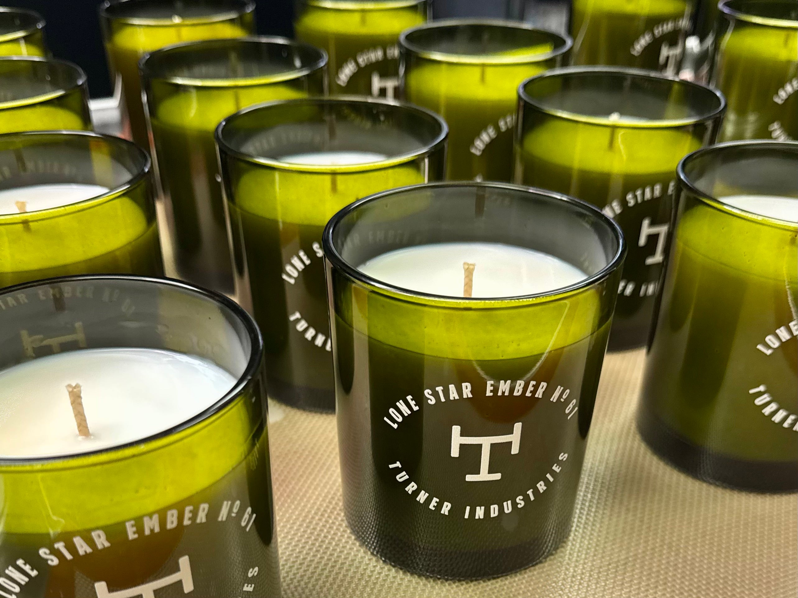 Corporate private label candles produced by DMJ Home Fragrance for Turner Industries with custom branding and fragrance.