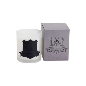 Signature Sunday candle by DMJ Home Fragrance in frosted white glass beside its gray DMJ gift box