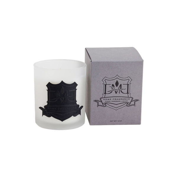 Signature Sunday candle by DMJ Home Fragrance in frosted white glass beside its gray DMJ gift box
