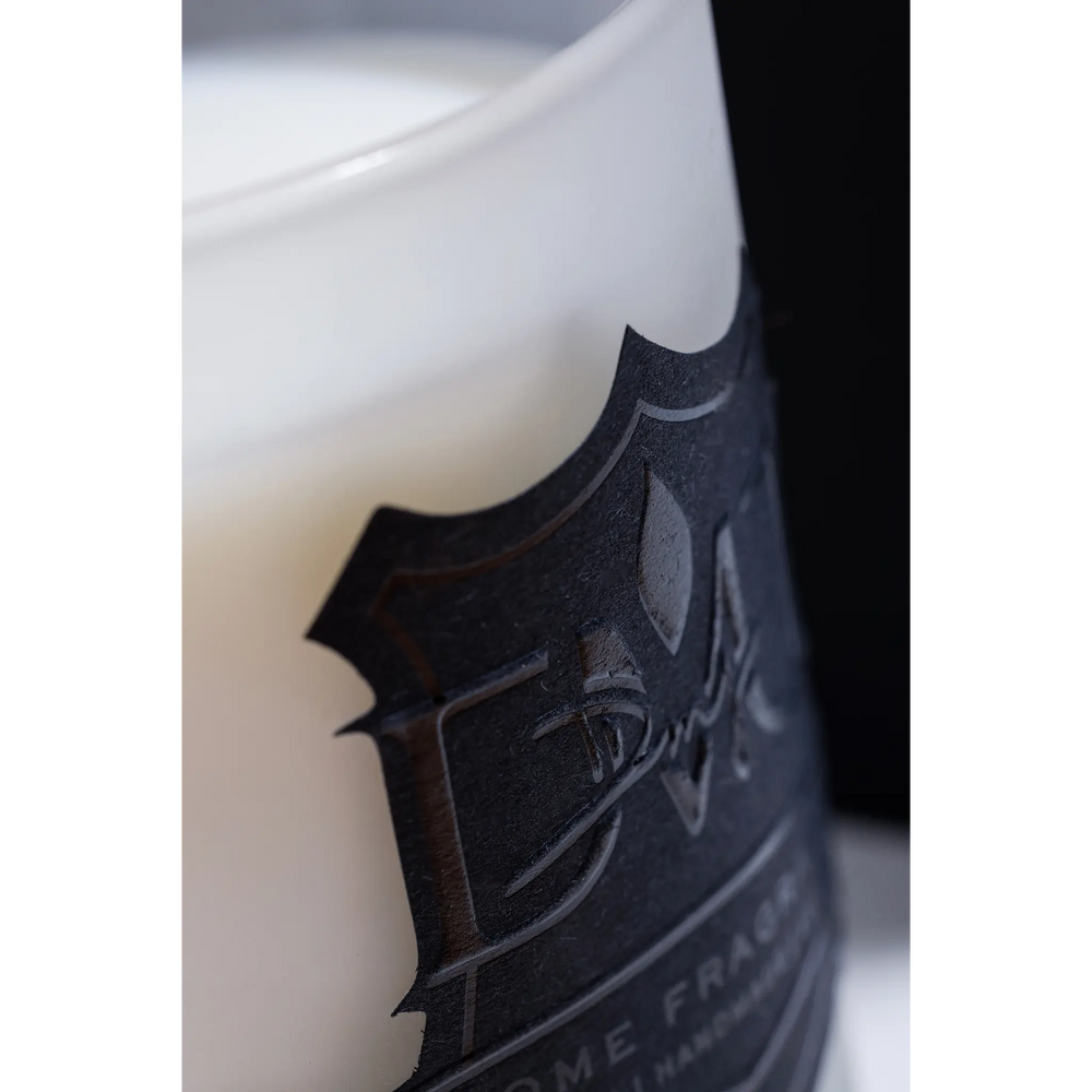 Signature Sunday candle by DMJ Home Fragrance in frosted white glass with a black crest label